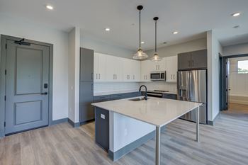 Fitted kitchen with island dining